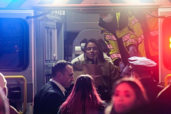 Medics remove an injured woman after a shooting inside the JD Sports store on Broadway and 41st Street in Times Square on Thursday, Feb. 8, 2024. (Gardiner Anderson for New York Daily News)