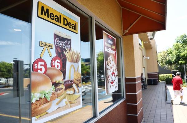 McDonald's restaurant in Burbank, California advertising extended $5 meal deal on sign.